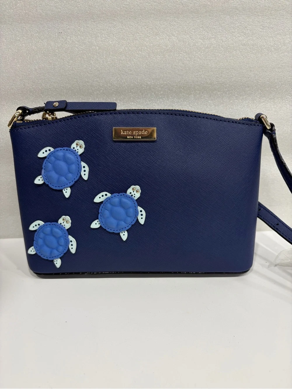 kate spade navy leather crossbody with blue sea turtle appliqués